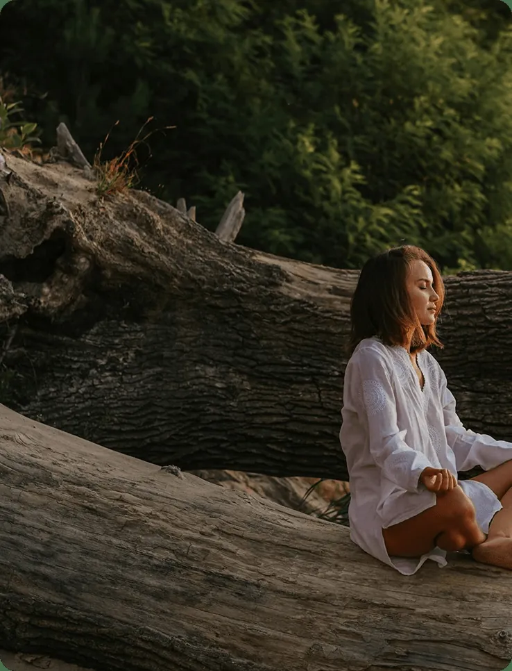 Woman meditating outdoors