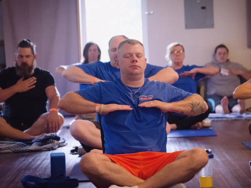 Veterans practicing breathing in a Project Welcome Home Troops SKY Resilience workshop