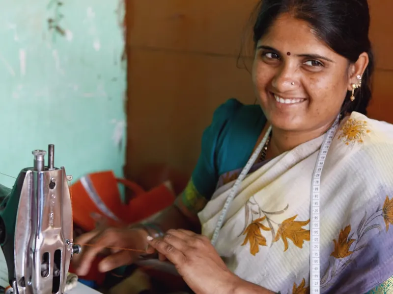 Woman at a sewing machine in a women’s empowerment vocational training program